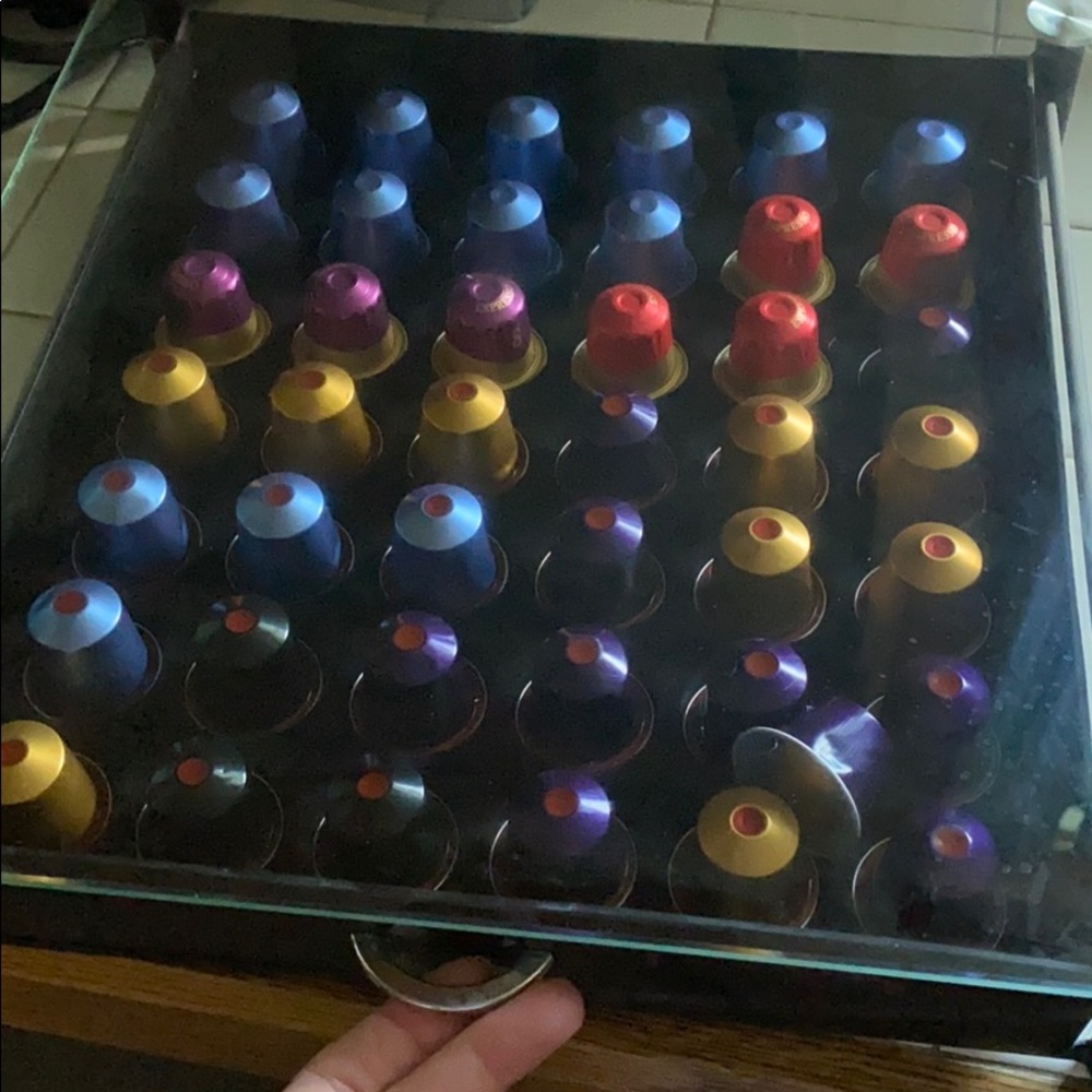 Fully stocked 83 Nespresso pods and storage